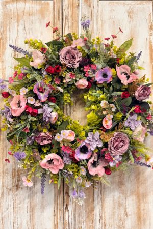 Enchanted Wreath featuring Anemones, Roses, Lavender, Ranunculus, Mixed foliages including ferns and Eucalyptus.