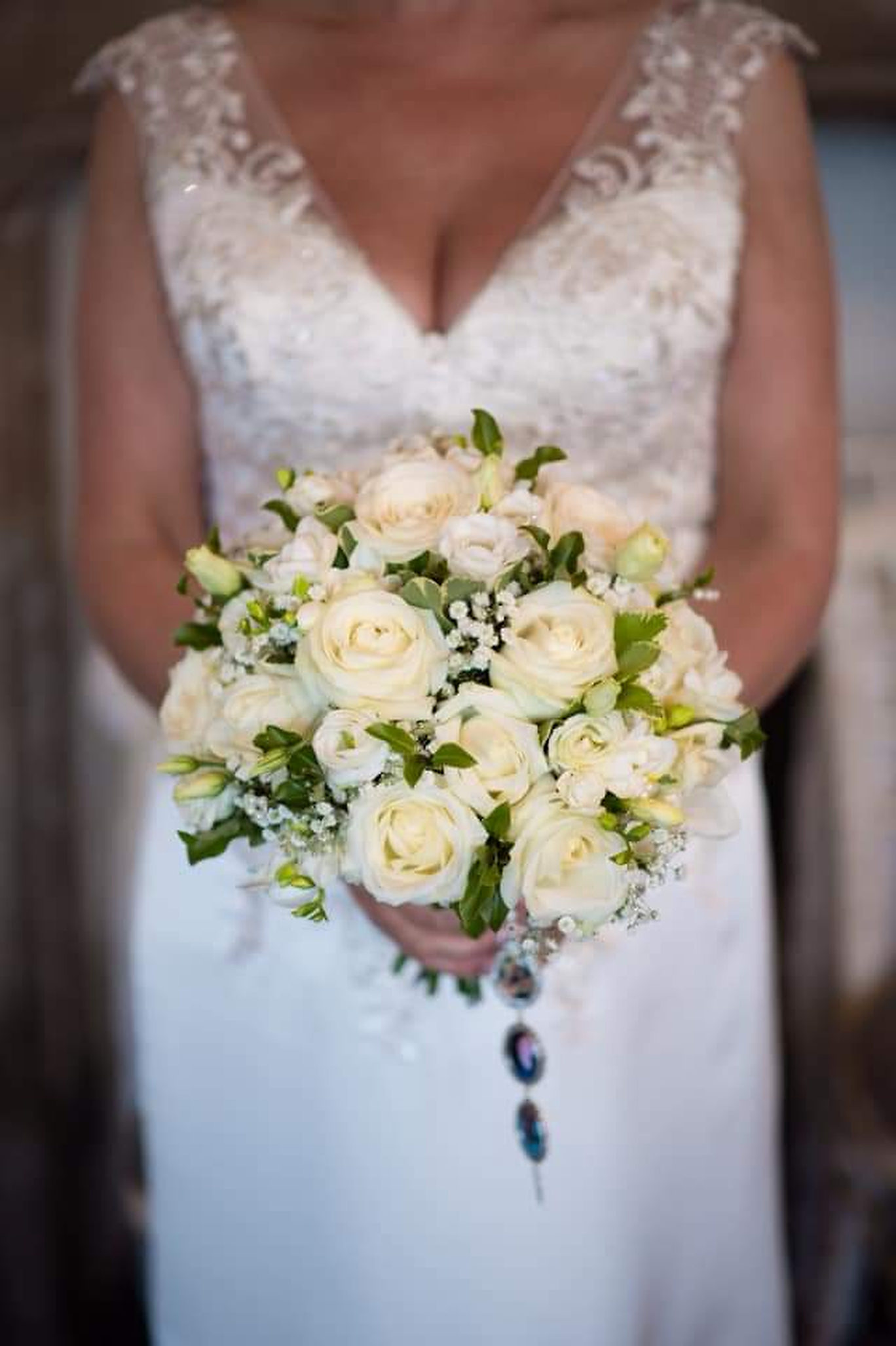 A bright colourful bouquet for this bride arriving at Church for her wedding with sunshine radiating through the church gardens, what more could you ask for your Staffordshire wedding